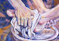 two hands are washing their feet in a bowl