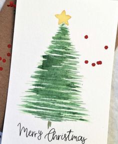 a card with a christmas tree drawn on it