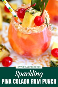 a pina cola rum punch with pineapples and cherries on the rim