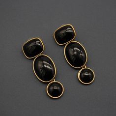 These vintage earrings are simple and classy. They add character and style to even a bland outfit. We dare say these vintage dangle and drop earrings are a conversation starter. The shape of the settings look very glamorous in its dark gold and black color.  These vintage earrings come in 3 colors; black, amber and green. These colors are all special and make a bold statement with an elegant appearance. The black and gold vintage earrings are adorable for a night out. The green and gold look for very fun and fastive while the amber pair of earrings are perfect for everyday purposes.  These black green and amber dangle circular earrings are pretty lightweight as well. The stopper at the back also keeps them secure. The needle is made from stainless steel for maximum comfort. Circular Earrings, Colored Earrings, Jewellery Vintage, Dark Gold, Green Earrings, Earrings Black, Vintage Earrings, Ghana, Black Green