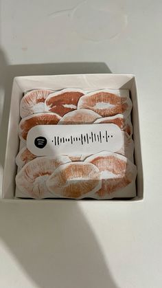 a box filled with donuts sitting on top of a table