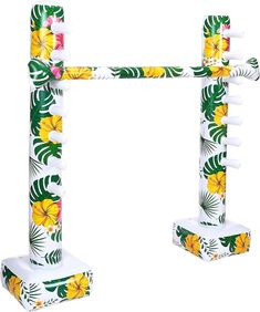 two white and yellow flower decorated poles