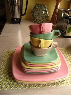 a stack of colorful cups sitting on top of each other