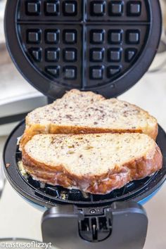 two pieces of toasted bread sitting on top of a waffle maker