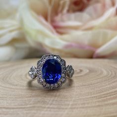 Oval Cut Blue Sapphire Engagement Ring 14k White Gold For Women Unique Vintage Halo Blue Sapphire Promise Ring, Halo Blue Sapphire Ring 6309 #OvalCut #BlueSapphireRing #14kWhiteGold #VintageRings #HaloRings #PromiseRing #BlueSapphire #UniqueRings #ForWomen #EngagementRings Classic Royal Blue Round Sapphire Ring, Classic Blue Sapphire Halo Ring, Gia Certified Blue Diamond Halo Ring, Blue Gia Certified Diamond Halo Ring, Blue Oval Gia Certified Halo Ring, Blue Sapphire Diamond Ring With Center Stone, Royal Blue Sapphire Ring Fine Jewelry, Classic Blue Halo Ring With Accent Stones, Blue Oval Diamond Halo Ring