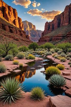 a river running through a desert with mountains in the background