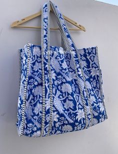 cotton print Bag The Indian Hand Block Printed Cotton Quilted Women's Handbags from Rajasthan India. This Handbag is completely Indian Printed on good quality cotton. Cotton quilted Jhola Bag made by Indian Artisans, this cotton quilted shopping bag is totally unique and multi purpose. Use this for your grocery or as a travel bag. Perfect to suit all. Item :- Cotton Handbag Material: Quilted Cotton Fabric Color - rainbow Pattern : Block Print Style: Tote Bag, Handle Bag, Shoulder Bag Size in Inch:- Height-18" inch Width- 19" inch Handle-13" inch Product Work: Printed & quilted Stitched Usage : Cosmetic, Make-up, Travel, Toiletries, Medicine, Accessories, Shopping and much more. Perfect for Beach Visits/ Quick Grocery runs/ Carrying Kids items/ Artist Paint book and Paints /Extra Bag Washab Blue Rectangular Canvas Bag For Beach, Large Capacity Blue Cotton Bag, Blue Canvas Tote Beach Bag, Blue Large Capacity Cotton Canvas Bag, Blue Cotton Canvas Bag With Double Handle, Blue Canvas Beach Bag For Shopping, Rectangular Cotton Summer Bag, Summer Rectangular Cotton Bag, Blue Canvas Beach Tote Bag