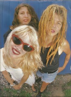 three young women with blonde hair and sunglasses