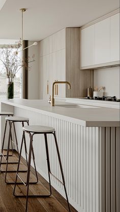 three stools are sitting in front of the counter top on this modern kitchen island