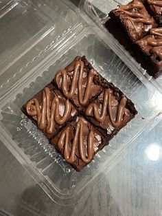 chocolate brownies in plastic containers on a table