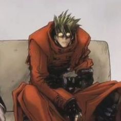 an anime character is sitting on a couch