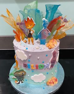 a birthday cake with frosting and decorations on it