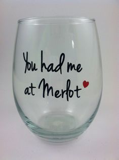 a wine glass with the words you had me at merlot written in black ink