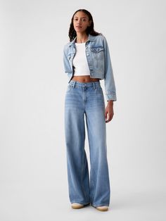 Fit:  A full-length, supersoft baggy jean that's fitted on the waist & relaxed all the way down.  ​ Fabric:  55% Cotton, 40% Tencel, 5% Recycled Cotton.  Stretch: No Stretch Jeans.  Authentic denim that gets better with every wear.  Made to wear all day & break in over time.  ​ Rise :  Mid Rise Jeans.  Look: A five-pocket baggy jean in a light or medium indigo wash.  ​ Details:  Zip fly & five-pocket styling.  Responsibly Made: This pair of denim is part of our water-saving Washwell program.  Compared with conventional wash methods, Washwell uses at least 20% less water and has saved over a billion liters of water since 2016.  Our Mid Rise Jean has a 10" 25 cm) rise. ​ Fitted at the waist and hip.  Loose, baggy through the leg.  Full-length jean.  Hits below the ankle. ​ 26" 66 cm) leg ope Style Wide Leg Jeans, Baggy Jeans Outfit, Baggy Jean, Jeans Look, Bdg Jeans, Winter Jeans, Wide Jeans, Break In, Women Denim Jeans