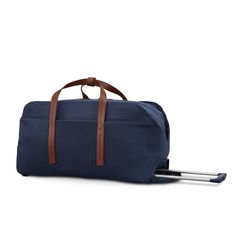 a blue duffel bag sitting on top of a white floor