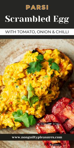 scrambled eggs with tomato, onion and chilli on toasted bread for breakfast or brunch