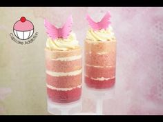 two desserts with pink frosting and angel wings on top