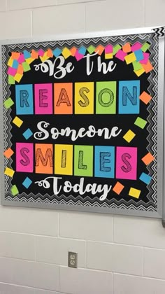 a sign on the wall that says be the reason someone smiles today in different colors