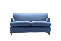 a blue couch sitting on top of a white floor next to a wooden leg chair