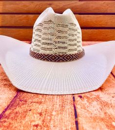 Hand beaded hat band. Gold, brown, and white pattern White Brimmed Hat Bands For Rodeo, White Ranch Hat, One Size Fits Most, White Southwestern Hat For Western-themed Events, White Southwestern Hat For Rodeo, White Southwestern Hat For Country Events, White Southwestern Style Hat For Rodeo, Southern Style Brown Hat Bands For Rodeo, Southern Style Brown Hat Band For Rodeo, White Southwestern Short Brim Hat