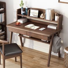 a wooden desk with a book shelf and chair next to it