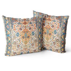 two pillows with an intricate design on the front and back, both in blue and orange