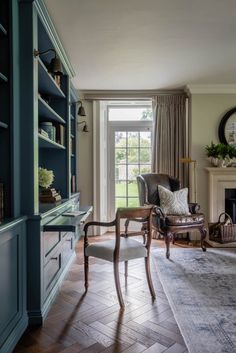 a living room filled with furniture and a fire place