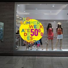 two mannequins in front of a store window with the words summer week at 50 % off