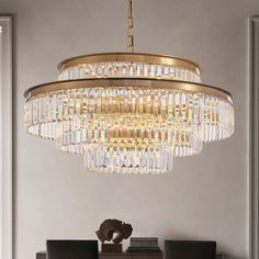 a chandelier hanging from the ceiling in a dining room