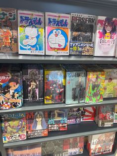 many anime books are on display in a store