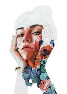 a woman with flowers on her face and hands