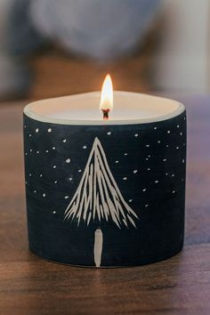 ceramic candle lit on a side table Winter Candles, Soy Candle Making, Winter Candle, Candle Aesthetic