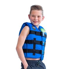 a young boy wearing a life vest and smiling