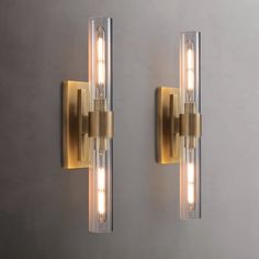 two lights are on the wall next to each other