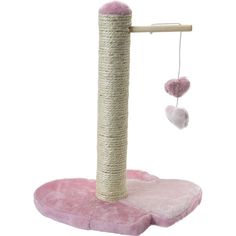 a pink cat tree with two hearts hanging from it's top and one on the ground