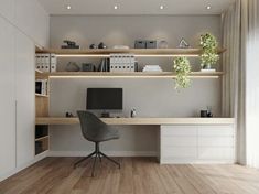 a modern home office with white walls and wooden flooring, built in shelving