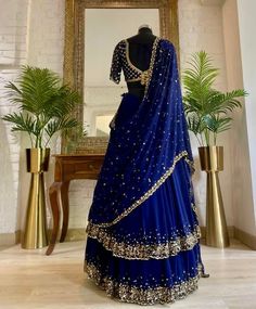 Embrace classic beauty with the Haseena Royal Blue Sequinned Lehenga Set. This exquisite set showcases a double layered lehenga adorned with sequins and zardosi work. The hand-embroidered blouse perfectly complements the lehenga with its intricate zardosi detailing. Complete your Wedding guest look with the matching Dupatta. Composition: Lehenga, Blouse and Dupatta - Georgette All products can be customised for sleeves, length of blouse and neck design Delivery : 4-6 weeks as the product is hand Double Layered Lehenga, Lehenga Sequins, Indian Wedding Dress Traditional, Royal Blue Lehenga, Indo Western Lehenga, Layered Lehenga, Christian Bridal Saree, Zardosi Work, Punjabi Outfits