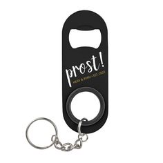 a bottle opener with a keychain that says,'prost'on it