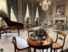 a living room filled with furniture and a grand piano