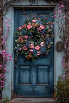 a blue door with pink flowers on it