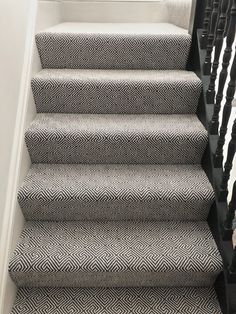 the stairs in this house have been painted black and white with herringbones on them