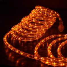 an assortment of orange leds on a table with one cord connected to the other