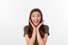 a woman making a surprised face with her hands