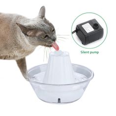 a cat drinking out of a water fountain with its tongue sticking out and an electric pump attached to it