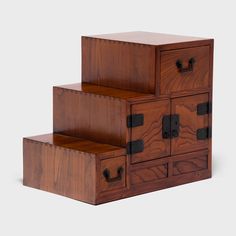 three wooden drawers stacked on top of each other