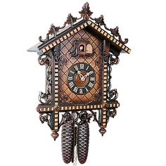 an ornate wooden cuckoo clock with pine cones