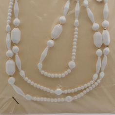 Long Vintage Czech necklace white glass beads White Beaded Necklace With Round Beads, Pearl White Necklaces With Beaded Chain And Round Beads, Pearl White Necklaces With Beaded Chain, Elegant White Long Chain Necklace, White Jewelry With Large Beads, White Pearl Jewelry With Oval Beads, White Pearl Jewelry With Faceted Beads, White Long Necklace In Costume Jewelry Style, White Long Beaded Necklace For Wedding