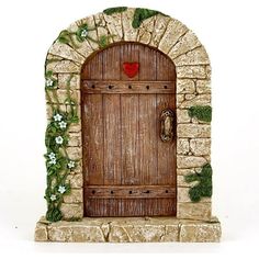 a figurine of a door with a heart on it