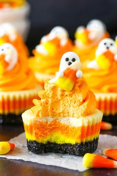 cupcakes decorated with candy and ghost decorations