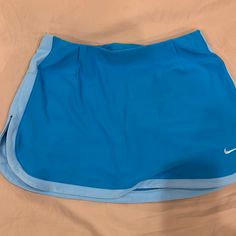 Nike Blue Dry Fit Tennis Skirt. Biker Skirts Attached Underneath. Never Worn Sporty Blue Skort With Built-in Shorts, Sporty Blue Short Length Skort, Blue Sports Skort With Pockets, Nike Fitted Mini Skort, Stretch Blue Tennis Skirt With Pockets, Blue Stretch Tennis Skirt With Pockets, Nike Mini Skort, Casual Blue Sports Skort, Blue Mini Skort With Built-in Shorts